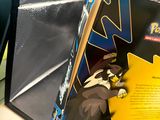 a box with a picture of a pokemon figure inside of it