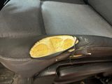 an image of a car seat with a slice of lemon on it