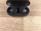 a close up of a pair of earphones in a case on a table