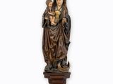 a statue of a woman holding a child in her arms