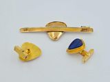 two pairs of gold and lapel pins and a lapel pin with a lapel pin