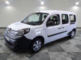 a picture of a small white van parked in a room