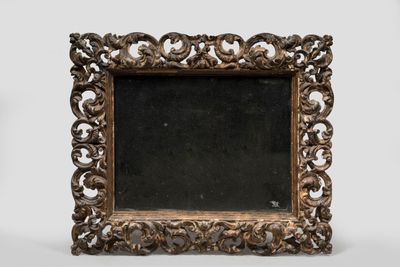 an old wooden frame with a mirror on a white background