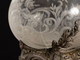a crystal ball sitting on top of a metal stand