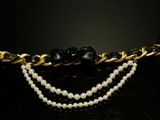 pearl and gold chain necklace with black flower