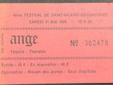 a close up of a ticket for a concert on a table