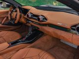 the interior of a sports car with leather seats and a steering wheel
