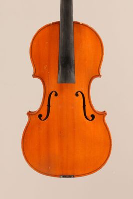 an old violin with a bow hanging from it ' s back