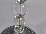 a glass vase with a flower on top of it