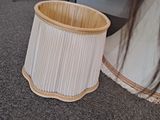 a lamp that is sitting on the floor next to a chair