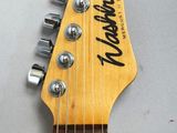 a close up of an electric guitar with a headstock