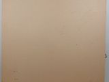 a brown piece of cardboard sitting on top of a white table