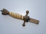 a picture of a sword that is on a table