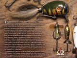 the back cover of a book with a variety of fishing lures on a wooden surface