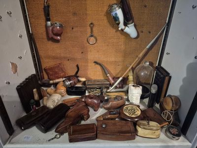 a picture of a collection of antique items on a table