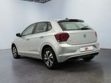 the rear of a silver volkswagen vw polo parked in a showroom