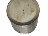 a metal container with a metal lid on a white surface