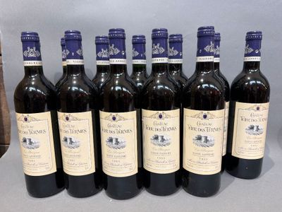 six bottles of wine are lined up in a row on a table