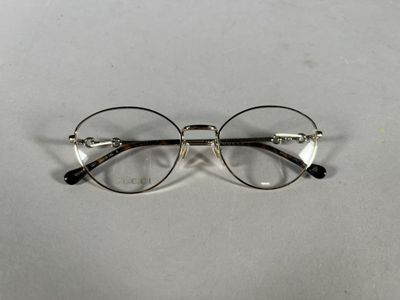 an image of a pair of glasses sitting on a table