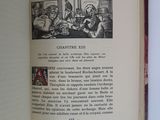 an open book with a picture of a group of people sitting at a table