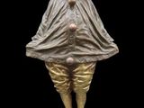 an image of a statue of a clown standing on a pedestal