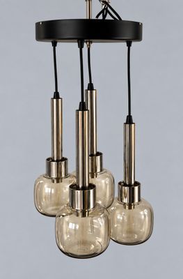 three glass globe chandeliers hanging from the ceiling