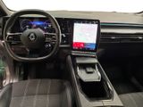 the interior of a car with a steering wheel, dashboard, and touch screen