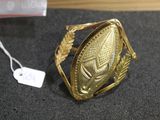 an image of a gold ring sitting on top of a table