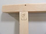 a close up of a wooden cross with a number on it