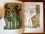 someone is holding a book with a drawing of a man and a woman standing next to each other