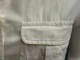 an image of a close up of a white shirt with a pocket