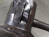 a close up view of a metal object with a black handle