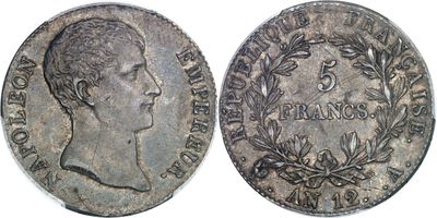 a silver coin with a portrait of a man on it