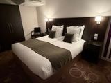 a large bed with pillows and pillows on it