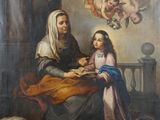 une image représentant un tableau où l'on voit une femme en train de faire la lecture à un enfant