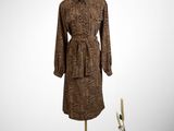 an image of a woman ' s dress and hat on a mannequin stand