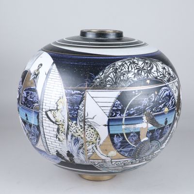 a blue and white vase with a painting on it