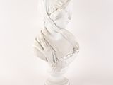 marble bust of a woman with a turban on her head