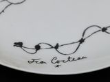 a plate with a drawing on it on a table