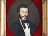 portrait of a man in a tuxedo and bow tie in a gold frame