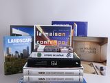 several books are stacked on top of each other on a table
