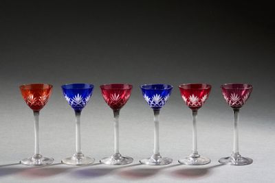 six red, white, and blue wine glasses lined up in a row
