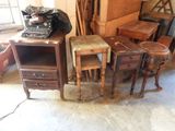 a pile of old furniture and a typewriter in a room