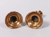 pair of antique brass candlesticks on a white background