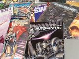 a lot of comic books sitting on a table