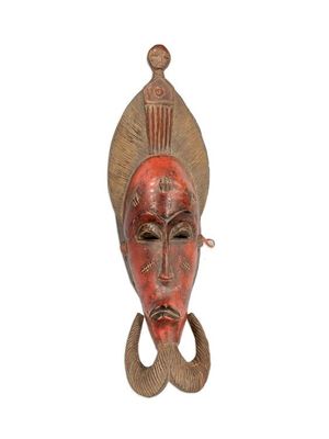 an image of a wooden mask on a white background