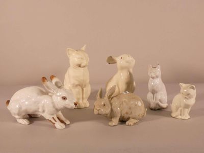 a lot of small figurines of animals sitting on a table