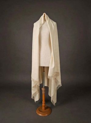 a white shawl draped over a mannequin mannequin mannequin mannequin mannequin mannequin mannequin mannequin mann