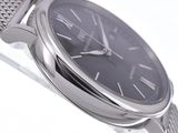 a silver watch with a black face on a silver bracelet