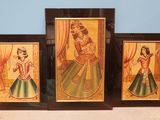 three framed paintings of women in traditional indian dress